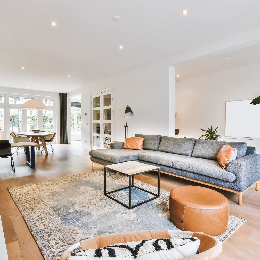 A living room with a couch and table